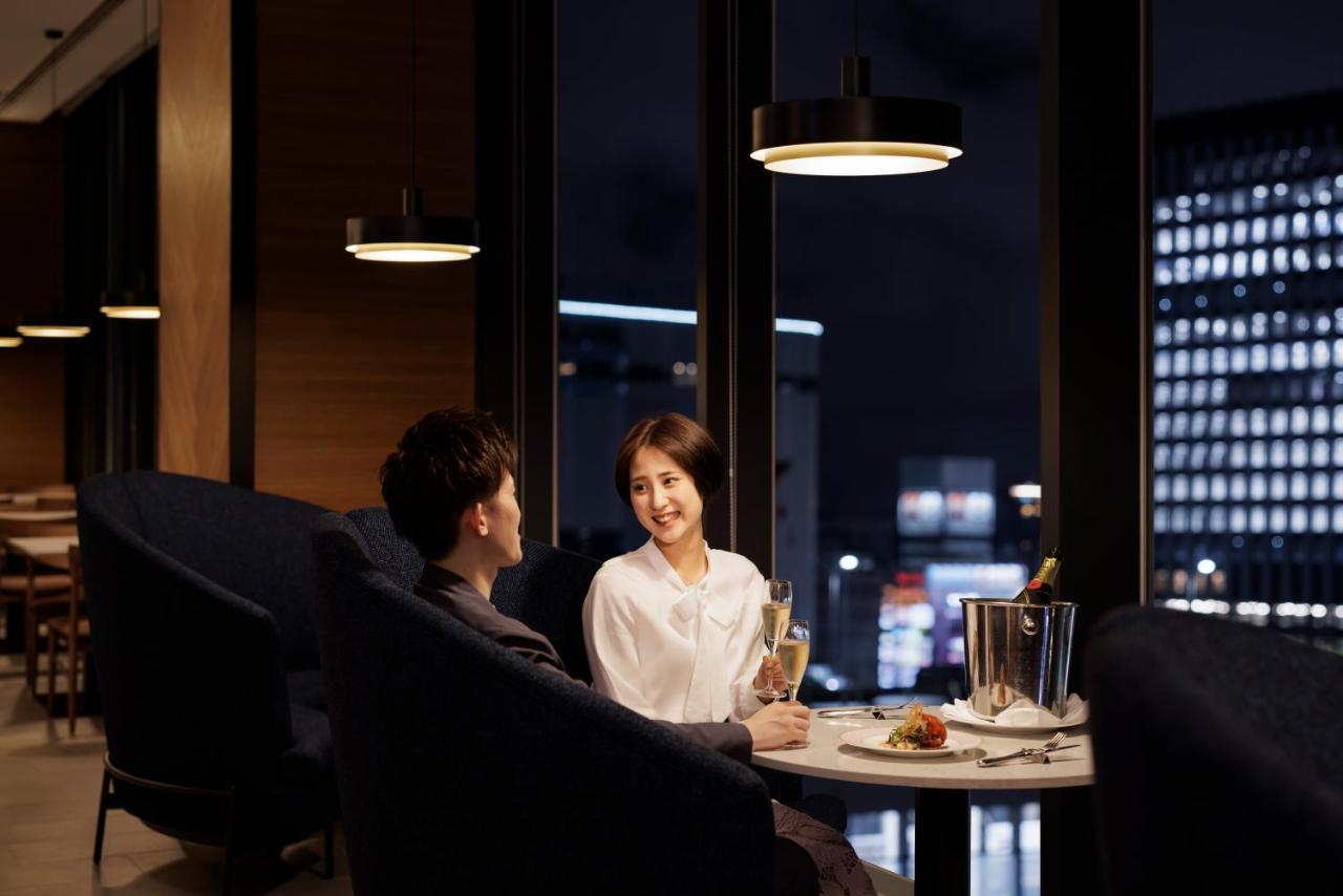 Sheraton Grand Hiroshima Hotel Exterior photo A couple in a restaurant